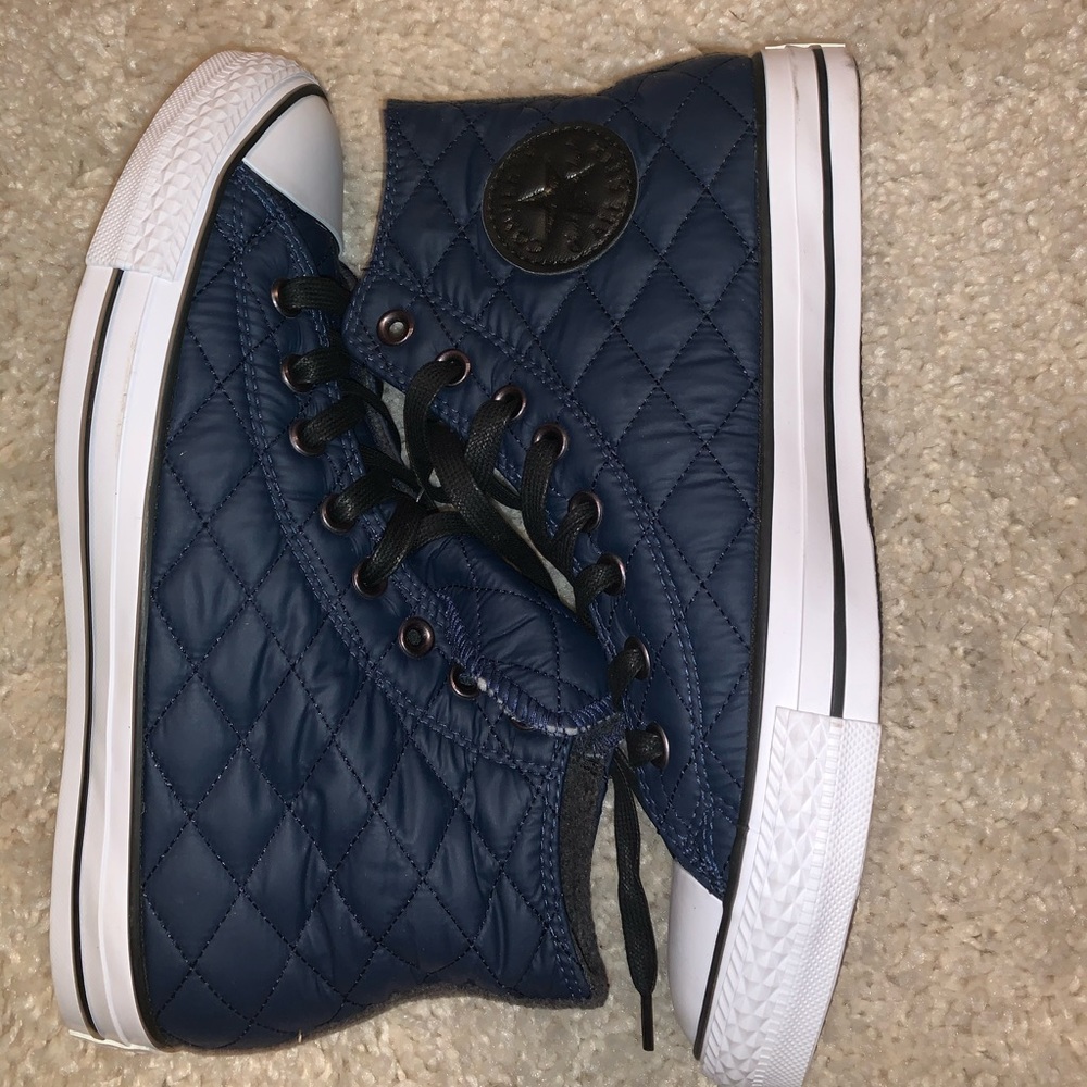 Chuck Taylor converse.  Black & blue